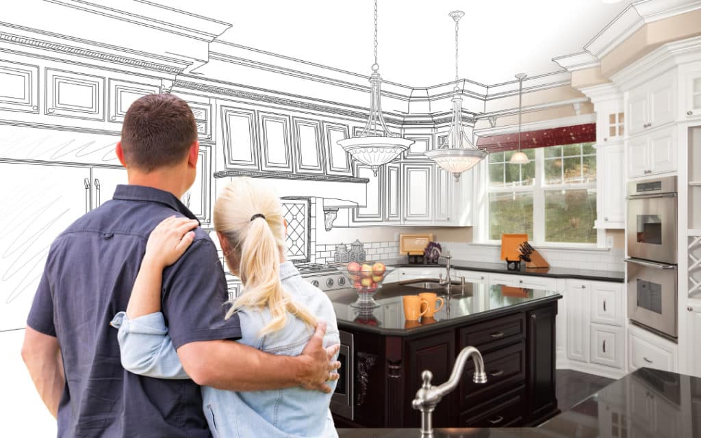 Couple looking at their home that's partly remodeled and half sketched.