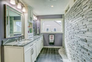 bathroom with custom stone shower