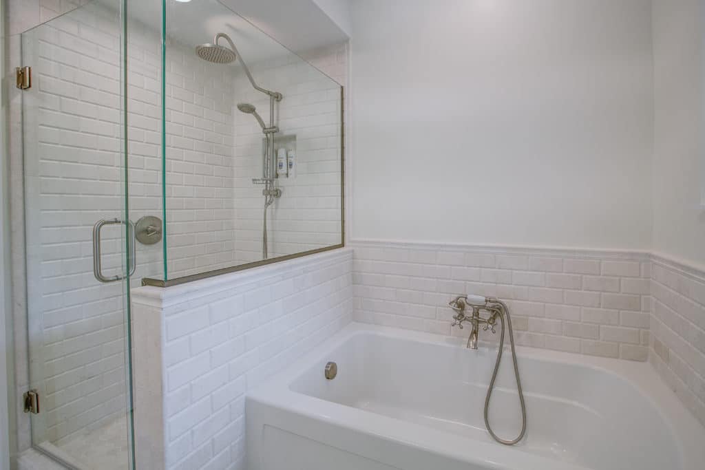 Bathroom remodel with glass shower and separate bath