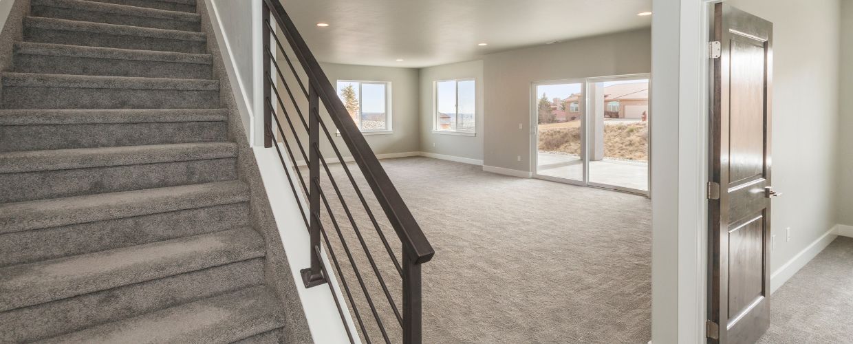 carpeted basement with added bedroom